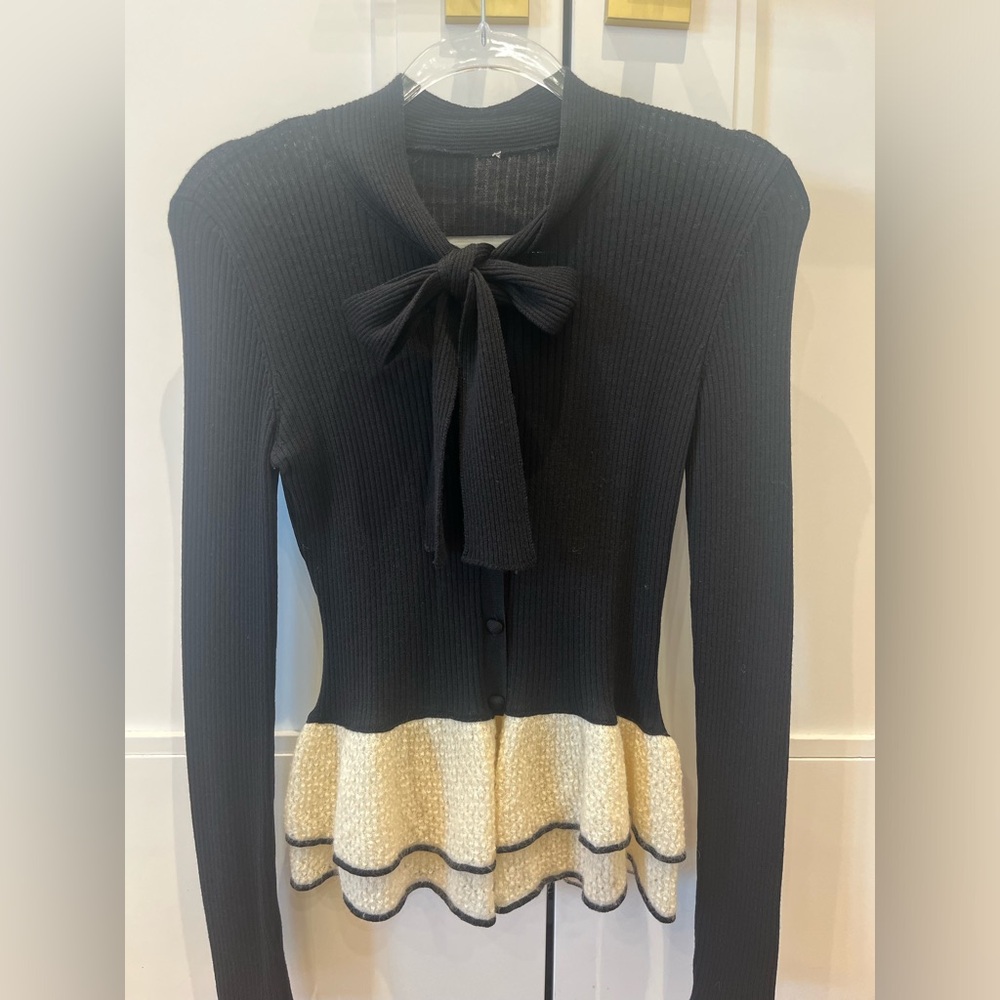 Red Valentino will knit sweater with peplum